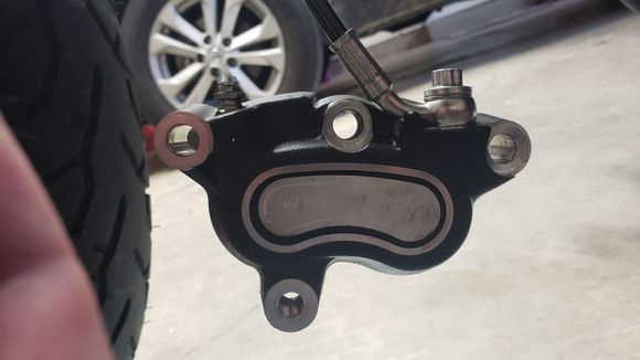 There is the long mounting bolt, (top left of pic)
There is the short mountind bolt, (botton left pic)
There is the pad pin, bridge bolt, (center top pic)
But, the far right bolt under the banjo fitting i removed is not noted about in my manual at all. 