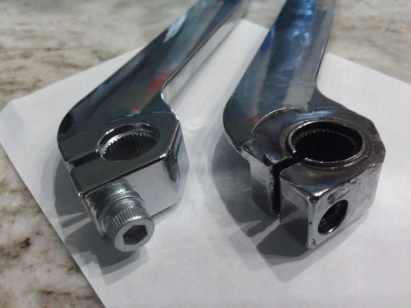 The new lever and the old lever. Severe wear on the old one.