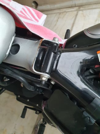 Remove the screw under the seat holding the tank