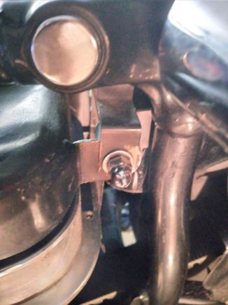 you can see where its's mounted , normally its supposed to go between the frame tab oil tank mount . . .