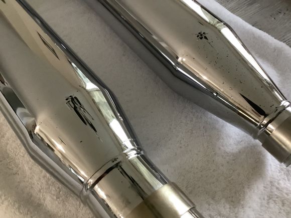 You can see the black spots on both mufflers in this picture 