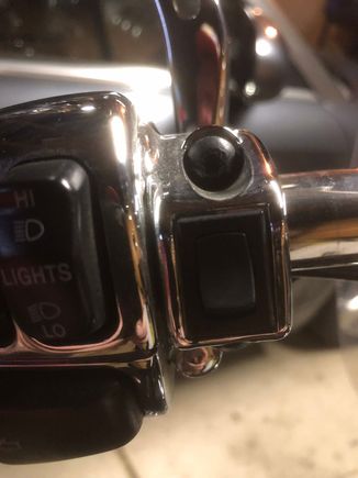 Here’s my garage door opener. Chrome and sits just inside the left side controls. Worked like a charm for the last 3 years....