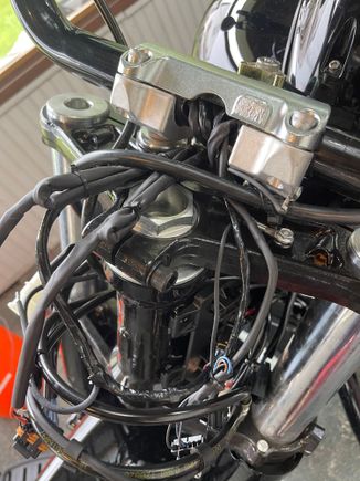 Clutch line going across the fork neck and zip tied to the riser. 