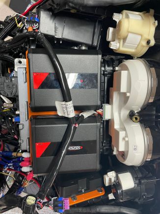 Amps mounted and the they clear finally.  DSP mounts on a plate on right hand side using the speaker pod mounting holes.  Have to remake the “shelf” on the left side to hold the power distribution blocks. 