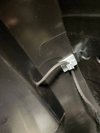 Instead of routing the wire on the top of the lid, I drilled a hole under where the light attaches to the lid. 