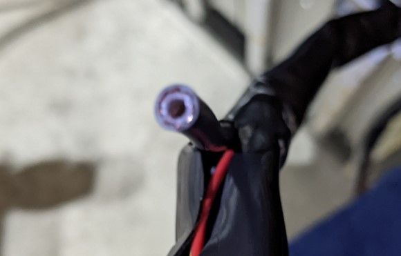 The cut coax coming from the tour pack