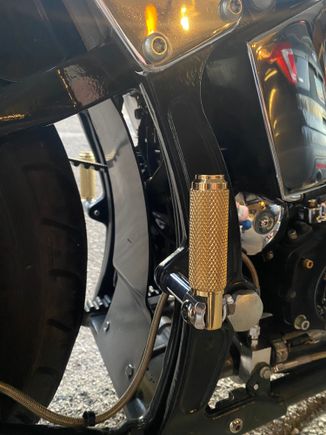 Solid brass passenger pegs with black chrome hardware and ditched the spacer on the exhaust side.