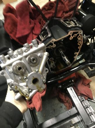 Cam plate removed. 2 o rings seal it by fitting into the crank case, and a third gets placed on the back of the cam plate. Mine all stuck to the crank case and the mo co shorted me one. Never re use these o rings.  It's not worth jeopardizing your lubrication system.