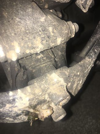 Doesn't help the bike is dirtier than a 7 mile hooker, but if you look close, you can see the isolator is starting to separate.