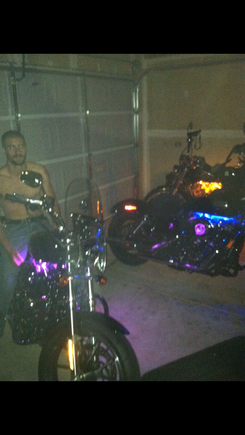 Another shitty pic but here's my fiancés bike on the left, my old street Bob in the middle and my buddy's sportster all the way to the right. I installed them under the tanks directly to the accessory plug. Very easy and only takes about 15 minutes.