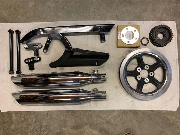 Everything in pic still available for XL Sportsters except the struts:

Adjustable lowering brackets 1"-3": $20
Stock mufflers '07-'13: $50
Top belt guard '04 up: $25
Bottom belt guard '04-'13: $20
Rear sprocket 68t '04 up: $25
Front sprocket 29t and nut '04 up: $25
3/16" Sprocket Spacer : $10

prices plus shipping