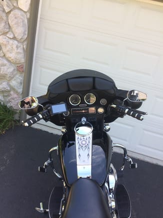 A few upgrades....Avon Air grips, Engine Turn console insert, mirrors from a 2008 Ultra, Street Glide seat, saddlebag guard eliminators, and T-Bags windshield bags.