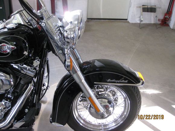 Front fender with all trims and front running light . Front wheel and full tread tire . ( no rotor)