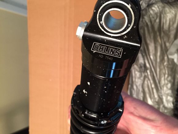 Packaging broke open causing pieces of foam to stick to shocks.