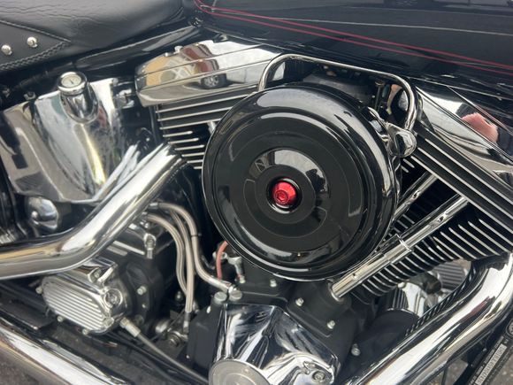 Used Duplicolor MetalCast to paint the bolt an anodized red to get very close to the red powder coat on the wheels