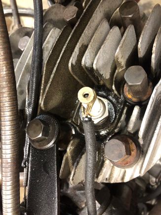 Front head, oil/fuel coming up around the spark plug