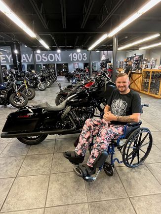 Sitting proudly next to my new bike. Apparently, they didn't care I couldn't ride away, as long as my money was green.