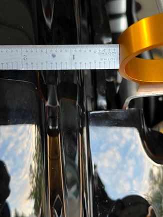 Measured the distance between the bracket & fender and split the difference. 