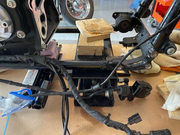 Use a scissor jack under the transmission and another scissor jack under the engine.