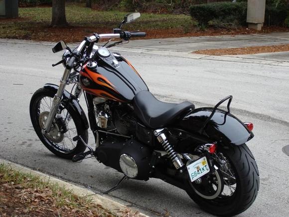 "Princess Dy" 2010 FXDWG: 1.25" drag bars, 2" riser spacers(spacer jim),black tribal (grips,pegs,mirrors,pedals),2" tank lift ($20 home depot), front signal relocation (free using stock brackets), Chrome front end kit ($178 the difference between stock replacement and chrome as the stock lowers were corroding)