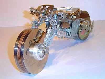 Model of a motorcycle made out of computer parts....hard drive platters for wheels, various case components for the rest.  Hey, I love Harleys, I do computers for a living..cool combo.