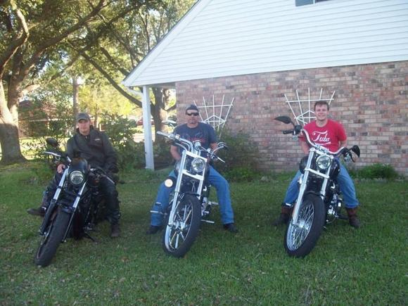 Us on Bikes.  Step son on left, me in the middle, and my son on the right.