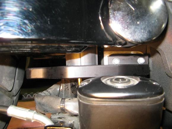 Here is the rear TT bracket installed; notice swingarm pivot at top of pic and rear brake mc in foreground of pic.