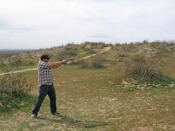 I love large caliber handguns. This is me shooting my .450 Marlin BFR. I also have one in .444 Marlin. My other favorite I didn't take a picture of but it is on my overall picture on the tailgate of my truck, it is a LAR Grizzly 50 (.50AE).