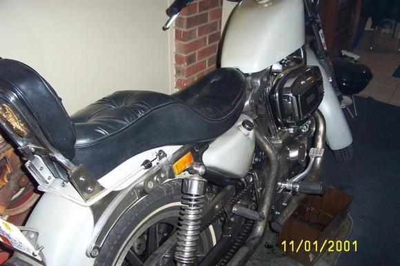 #1 032 rebuilt this past winter its no longer green its primer grey with a light coat of satin clear.got new seat.king sportster tank 3gal.bendix carb.none adj.main jet.its better than the butterfly khienen made for an 85' sporty.rewired bike myself with fac. man.specs.starts great runs geat.stock bore but honed .001ths.in.new fac.stock pistons  rings.lower end checked out like new,as did tranny,primary,heads,valves,cams lifters.i still need an exhast.im still running open drags front pipe ex.dia.is 2in.wheras the rear ex.pipe is 1.75i. or 13/4 in outside dia.