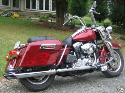 2001 Road King with red candy paint over goast flames.  Was a sweet bike!  SOLD!