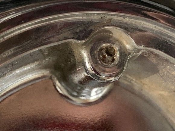 Started to drill out screw, stopped when I realized hole was not centered