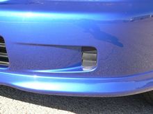 Driver side - unmodified fog light recess.