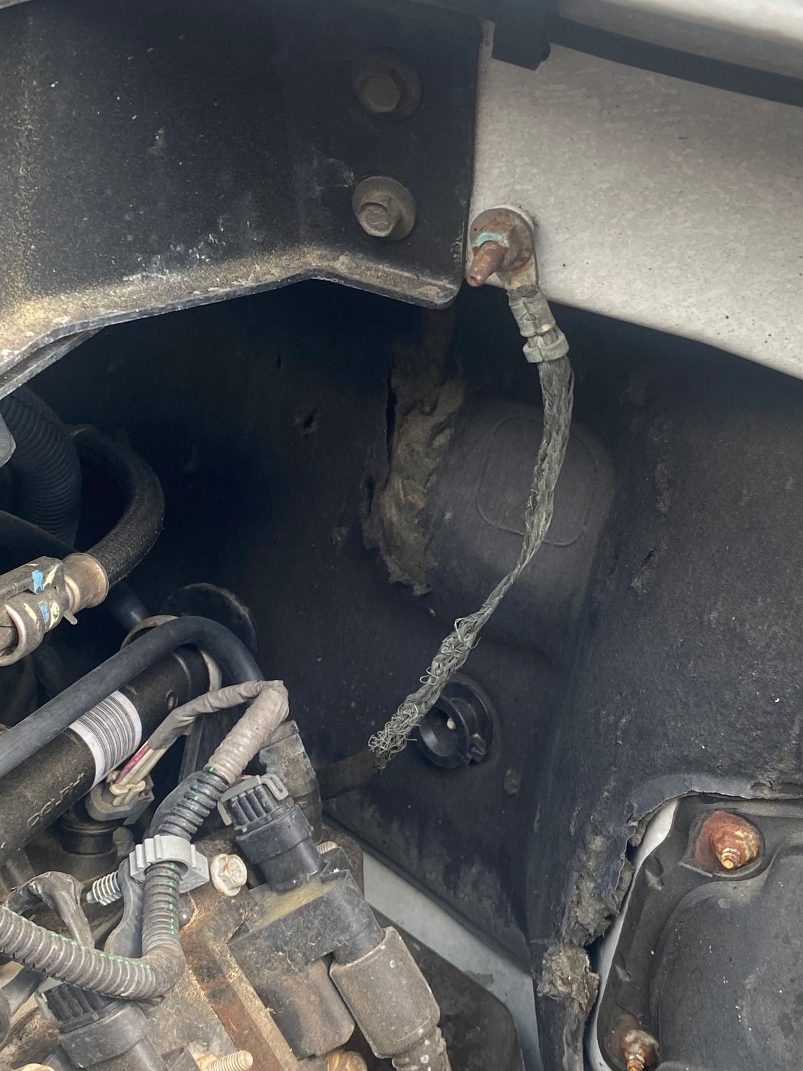 Ground strap looks frayed and corroded to me?