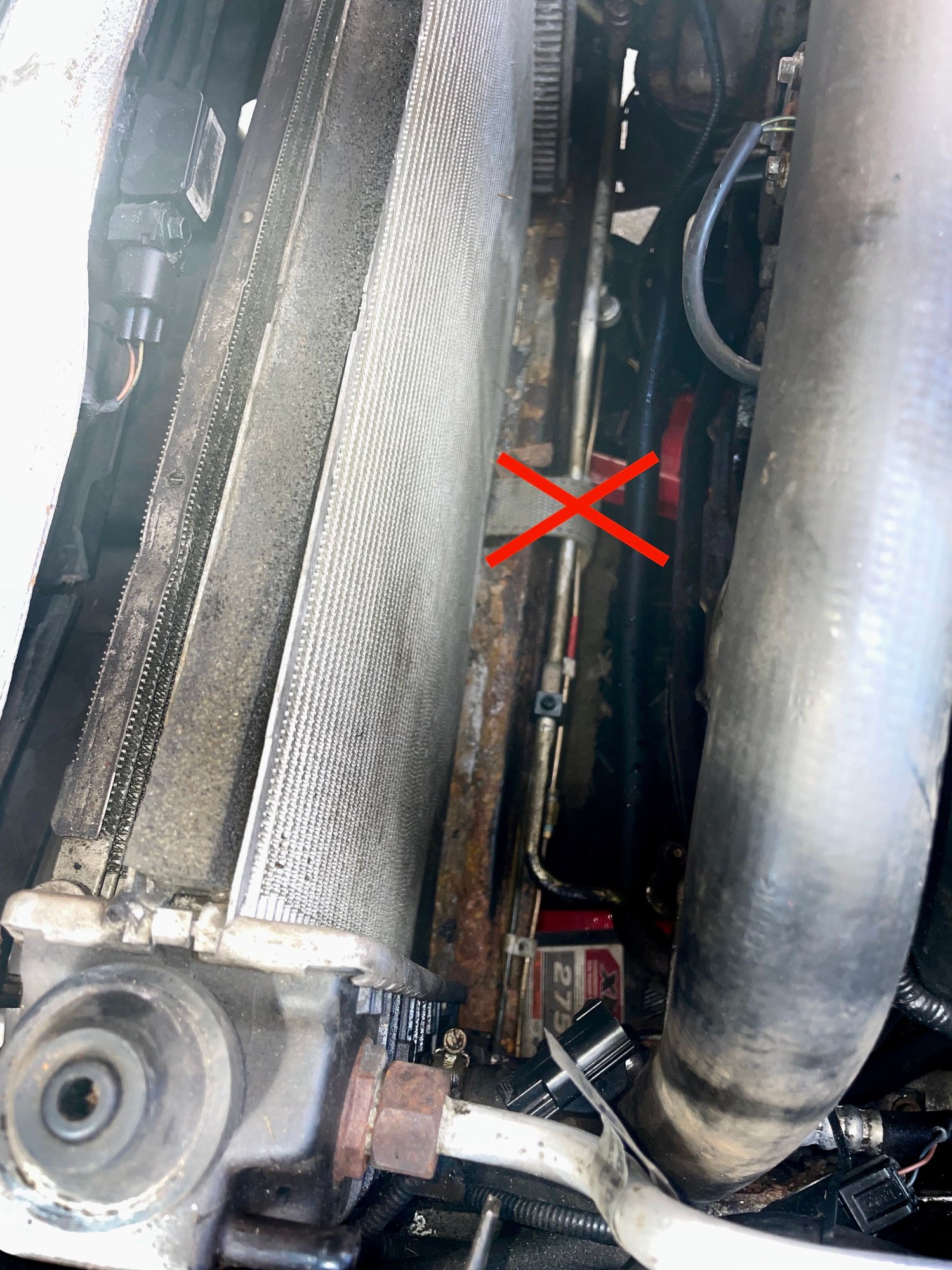 STRAP THROUGH A VERY NARROW SLIT DONT GO OVER THE PIPES