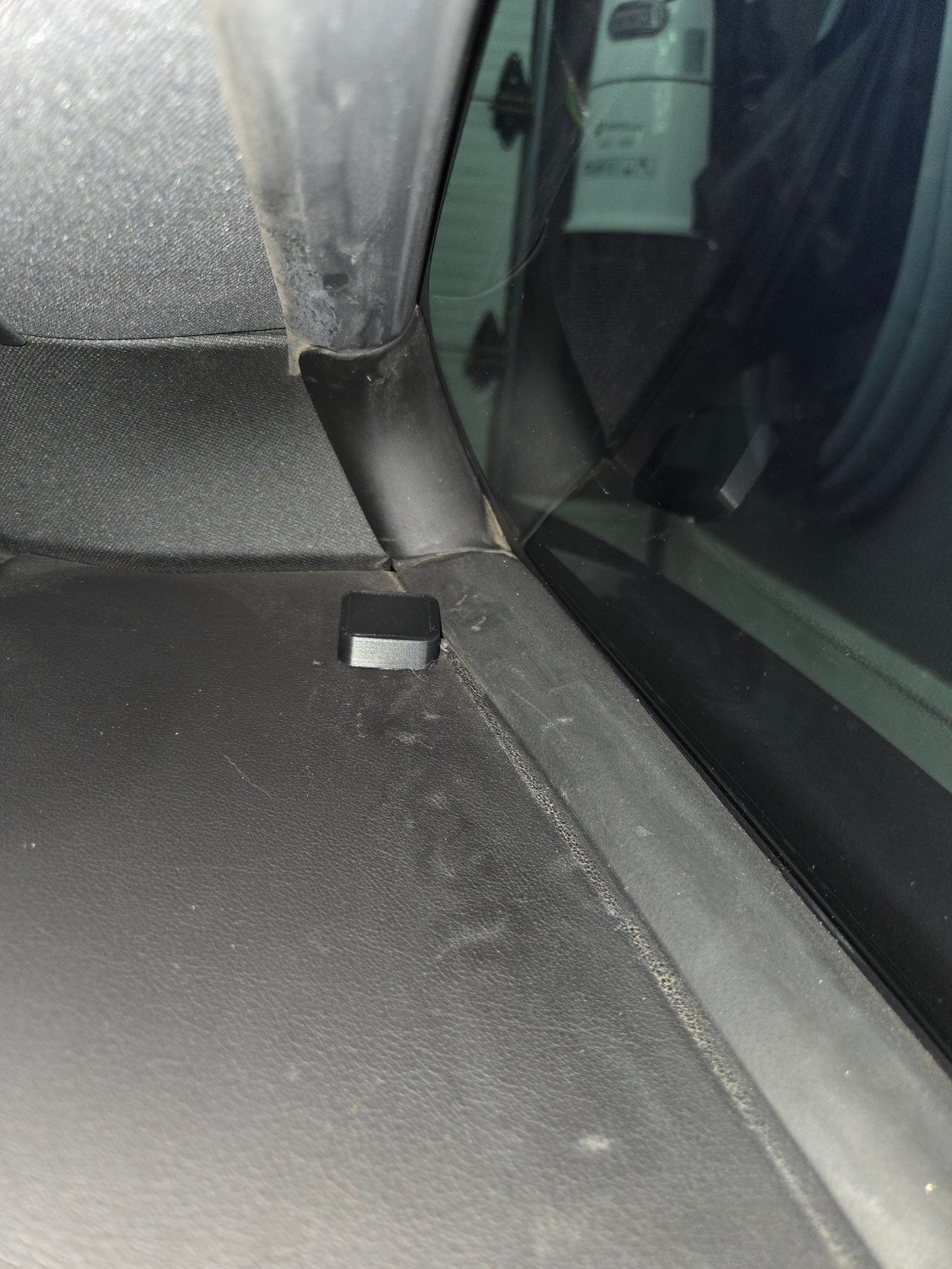 Gps unit mounted behind driver seat.