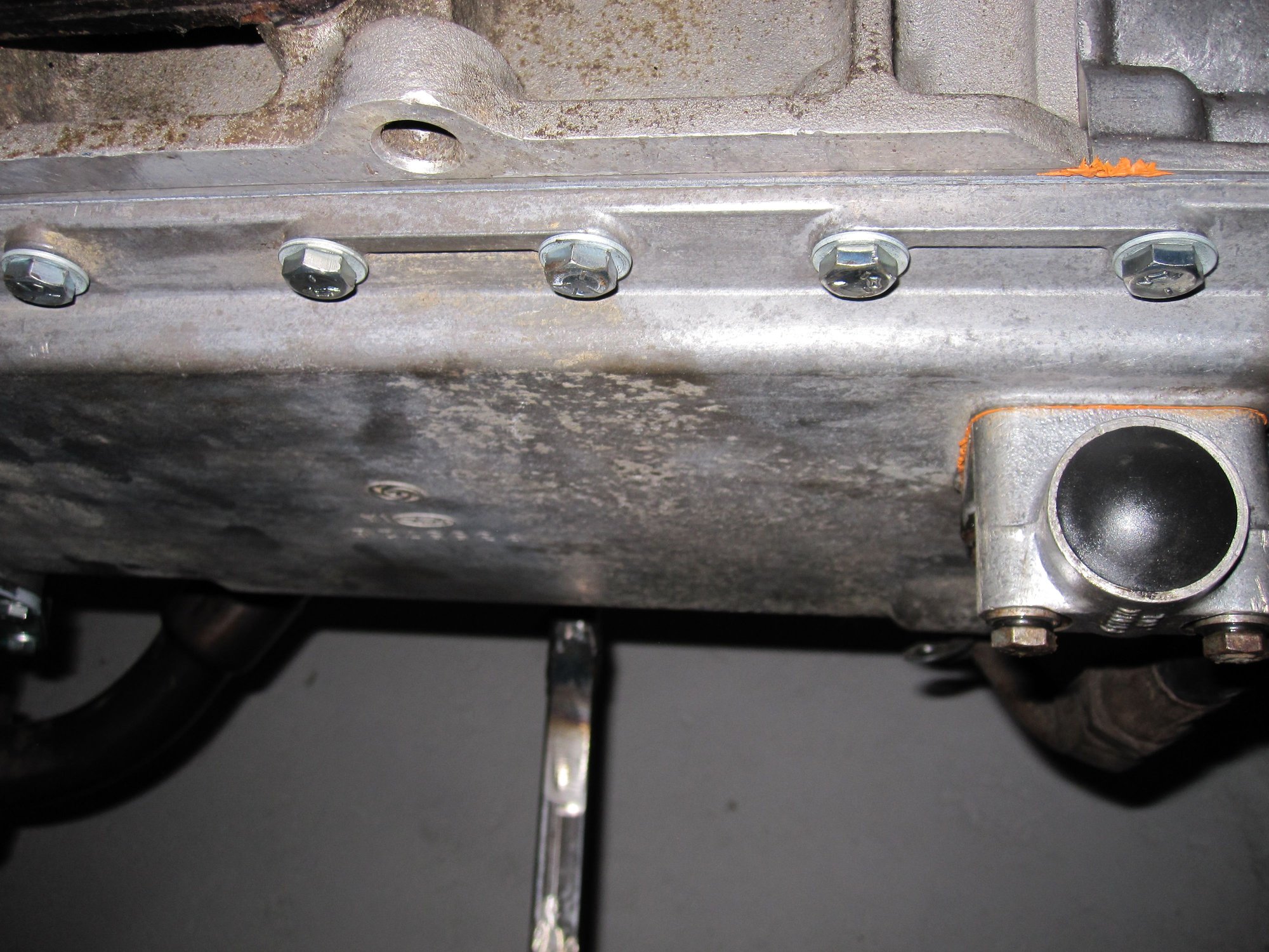 Bypass fitting on sump front right corner can be unbolted