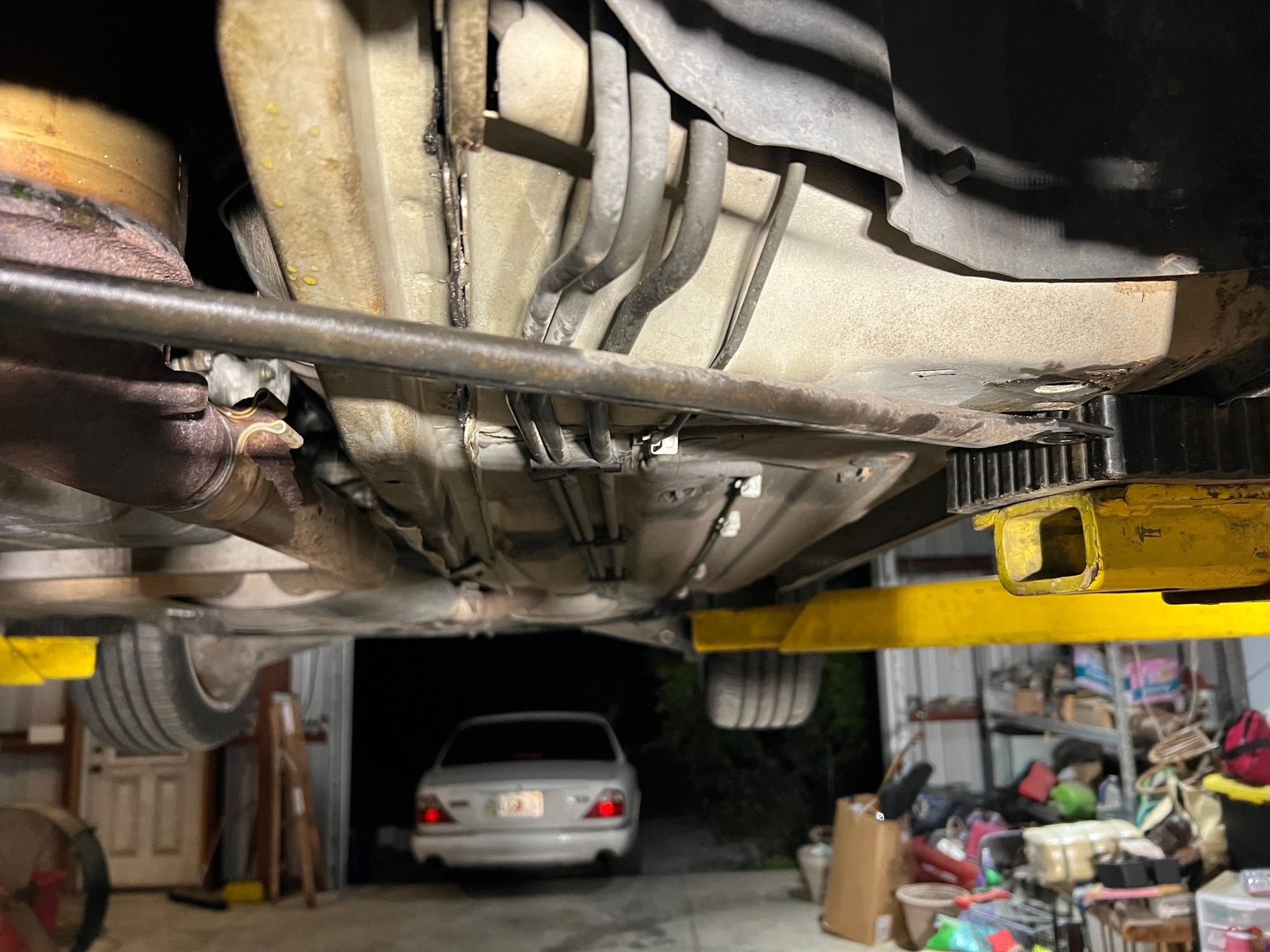Convertible so has X support.  Disconnecting aft bolts gave just enough room to rotate breaker bar to loosen.