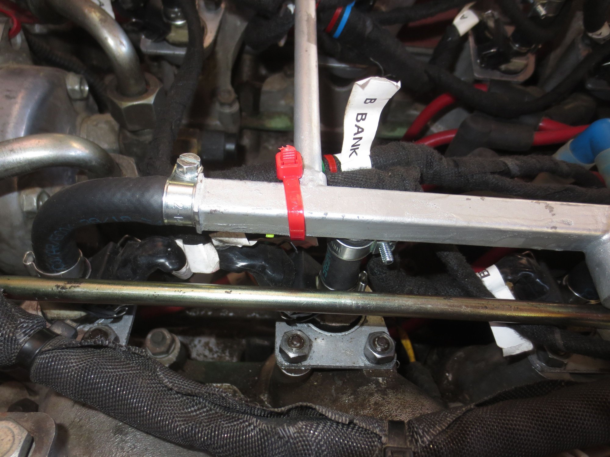 New loom being cable tied to the rail, NOT in the bottom of the V.