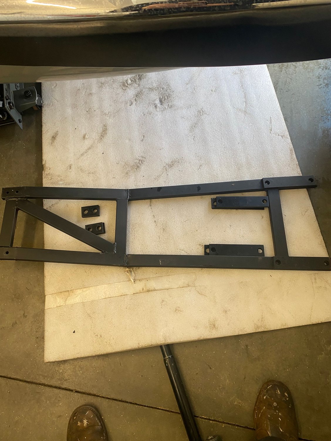 This was (poorly) mounted under (or I guess across?h the IRS. I�ll mount it back but my problem- can I drive safely without it installed? in the past the forward mounting threads were destroyed. I could weld weldon nuts in my garage but I have access to a lift 20 minutes away making this job way easier.