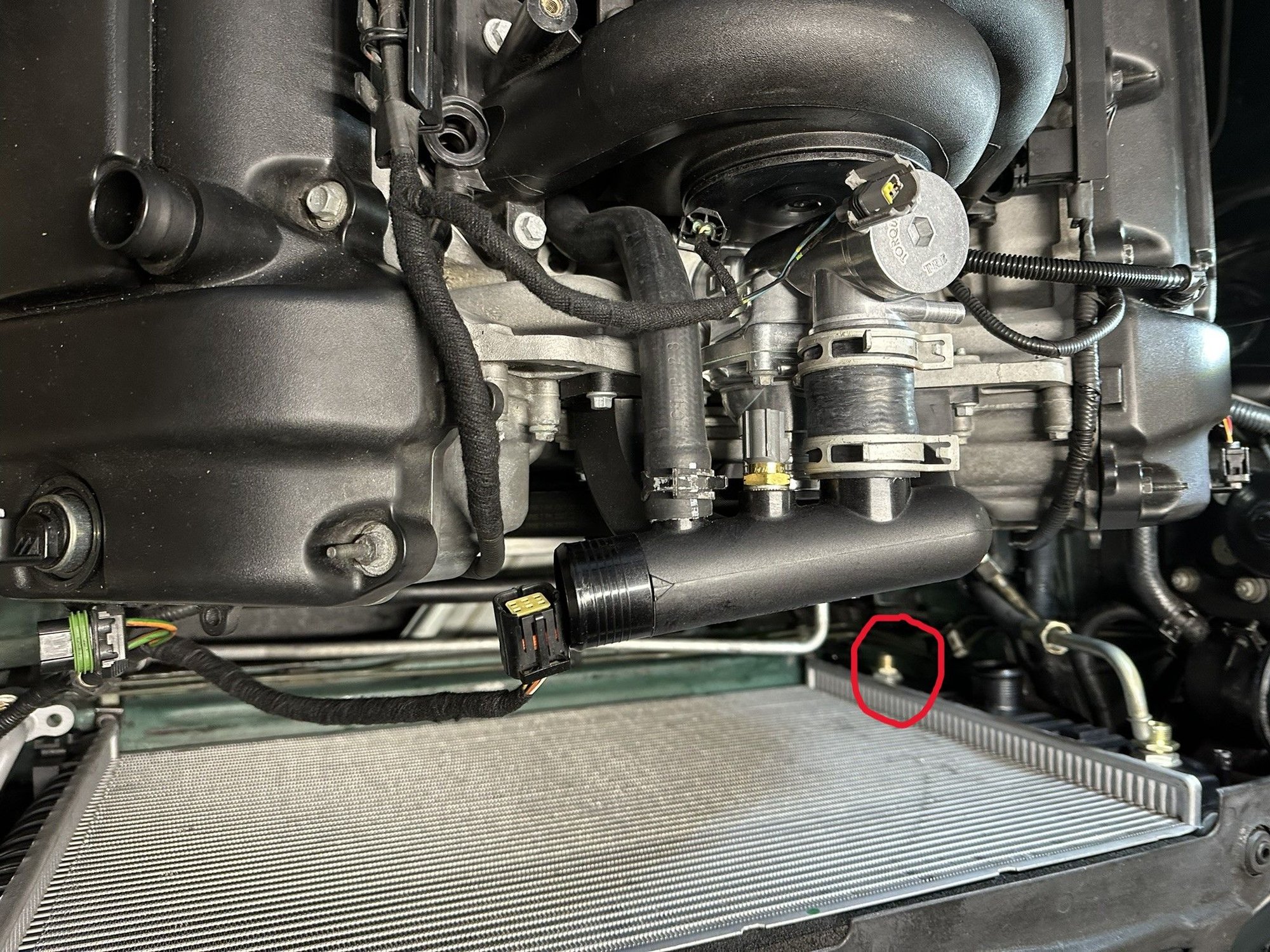 Red circle is around the lowest oil port 