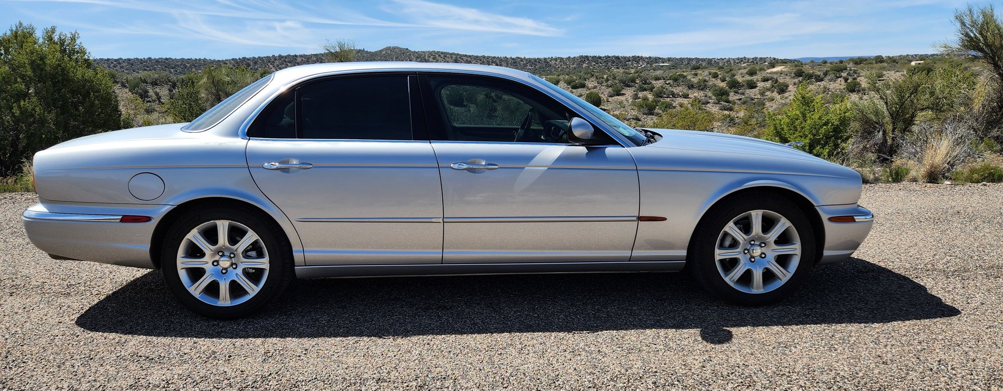 My 2004 XJ8 has 205,000 miles and has been a daily driver in Arizona since new.  It still runs and drives like new, best car I've ever owned.  It's had 3 or 4 sets of running gear, 3 water pumps, new fuel pump, new radiator, 2 or 3 sets of mounts, many new hoses etc., etc. but the engine and transmission are still untouched. I replace worn out parts when needed and it's like new again every time.   Color Silver Patina 