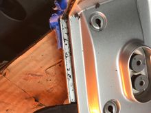 Working putty knife around perimeter between shells.