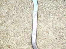 S shaped wrench did the trick, the way the engine bracket is made I couldn't get a ratchet on it. Tried everything else I had...Murphy's Law