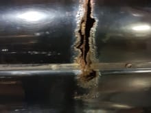 rusted completely through...1.4mm steel sheet...