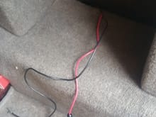 What are these two wires????....My mechanic found them behind panel in trunk passenger side not connected to anything
But look like they had been at one time ....one is red and one is black. ...red one has in line fuse.....what could these be????