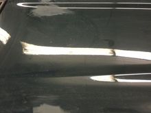 2000 grit used to flatten the obvious issues in the clear coat on the hood.  From Dave's estimation, this car has been painted a few times over its lifetime...pointed out a fisheye on the roof that had escaped my notice...and mentioned that the reason the front of the bonnet  was so stone chipped was that when the bonnet was repainted, the shop that did the work did not bring the surface down to primer, but just sanded the top coat and reshot.  This makes the paint too thick, which chips easier.