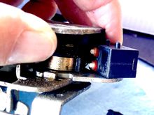 Orientation of the 2 plunger microswitch in the latch. The two plungers contact adjacent cams of different shapes. I don’t know what the cams and switch do. Can anyone tell us what this switch does?