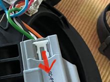 Easily done by releasing and pushing forward on the side tabs that hold it in place