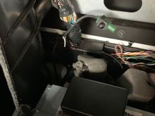 I have a unknown Fakra plug the just ends as in the picture in between the seats.It doesn’t rattle for me but could as it ends just right next to a metal cross brace that runs across the back wall and could transmit a rattle to either side.