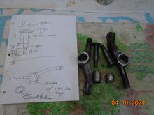 I have burned off the old rubber and pressed out the sleeves.  The pins have dia of 5/8"  The bore in the mating piece is almost exactly 1 inch. 